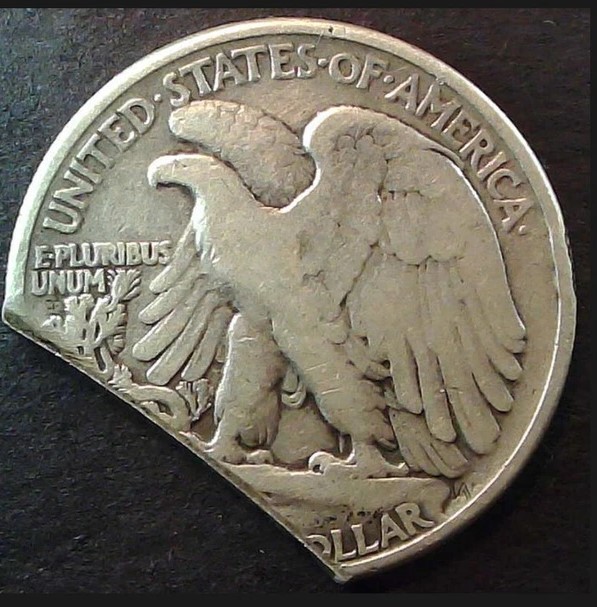 1929 Walking Liberty half dollar clipped planchet error showing curved missing section at coin edge
