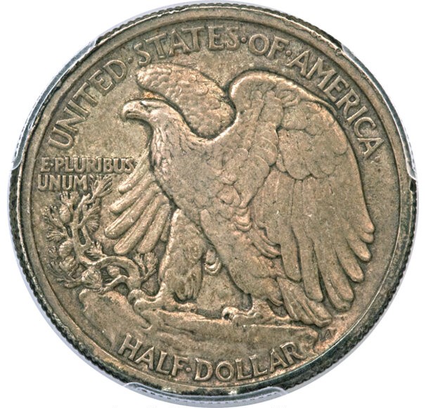 1929 Walking Liberty half dollar planchet lamination error showing surface metal separation and delamination on the coin surface